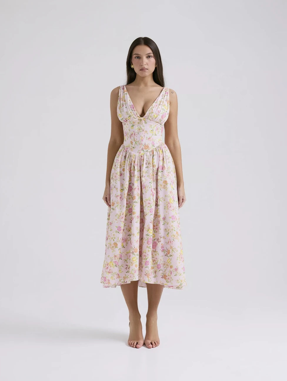 Woman wearing a floral dress on a white background