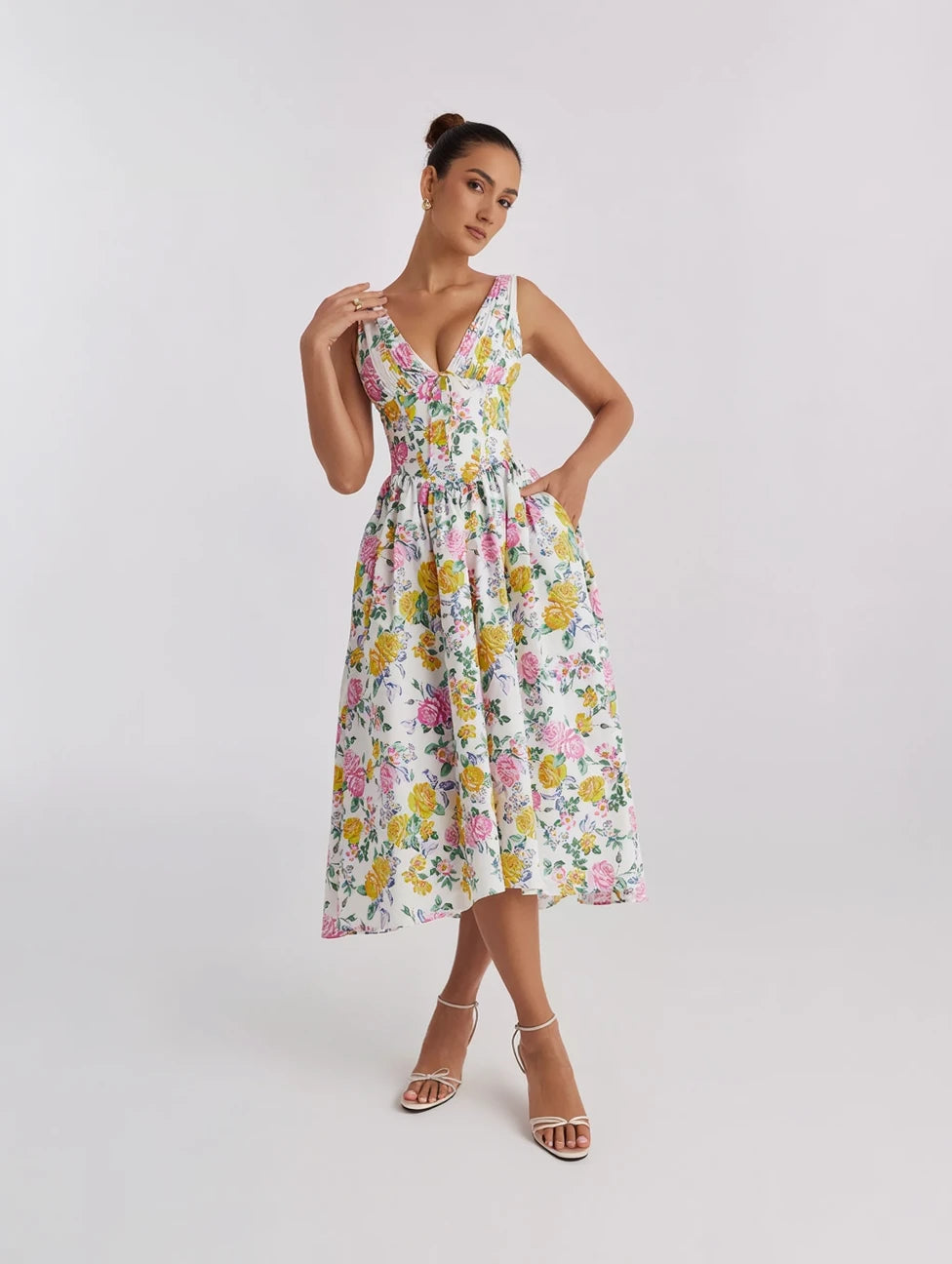 Woman wearing a floral dress on a white background