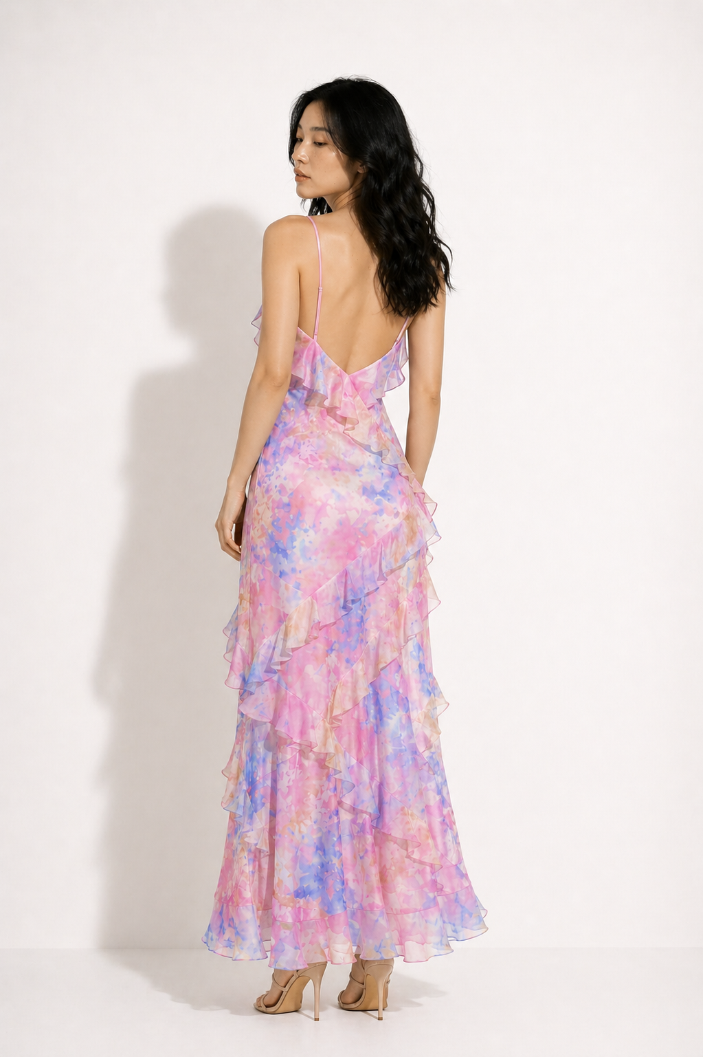 Woman wearing a colorful dress with a white background