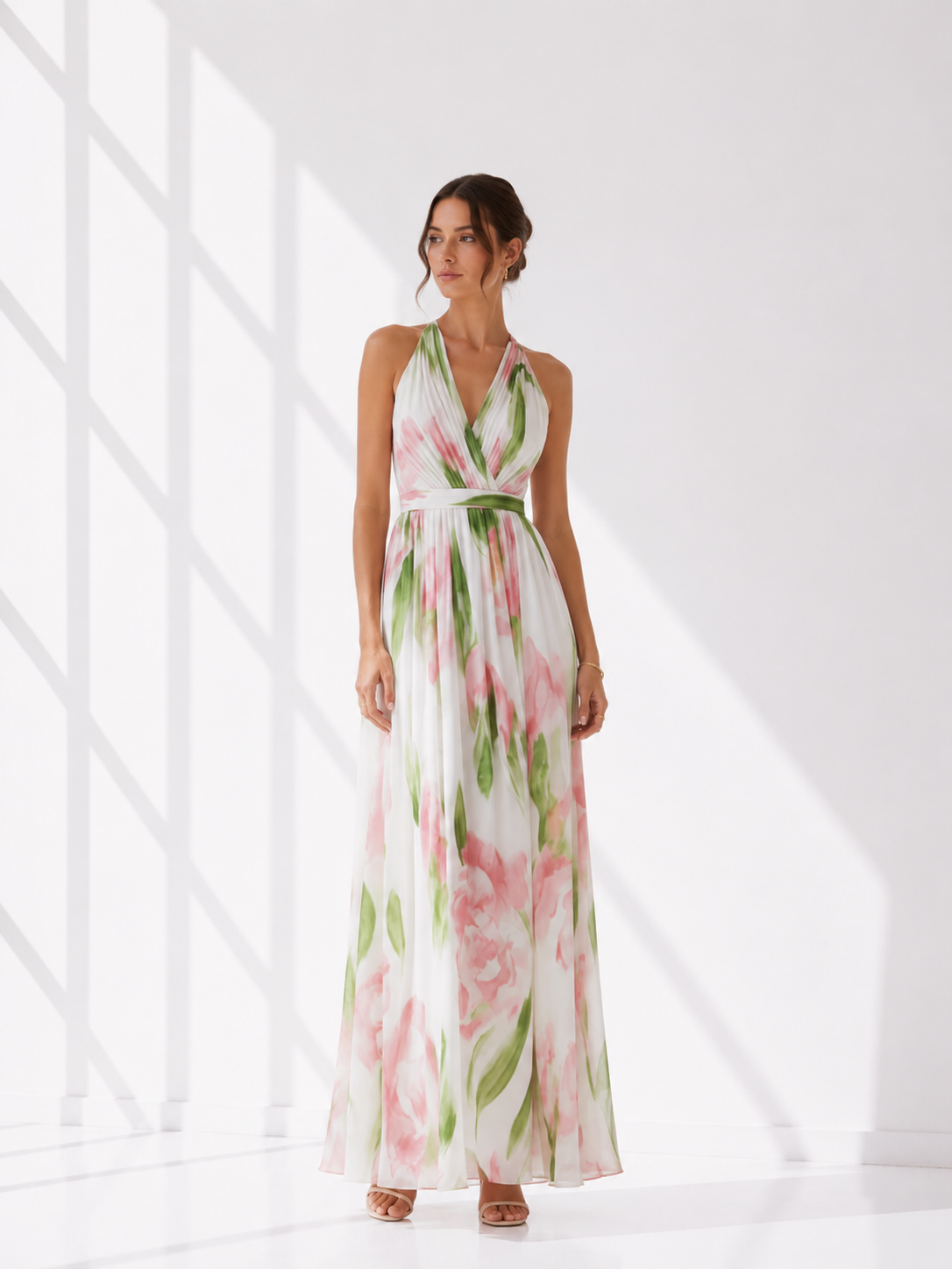 Woman wearing a floral dress against a white background