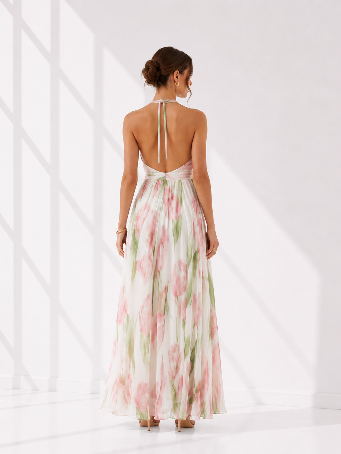 Woman wearing a floral dress with a white background