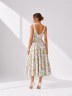 Woman wearing a floral dress on a white background