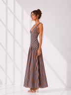 Woman wearing a striped dress against a white background