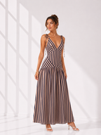 Woman wearing a striped dress against a white background