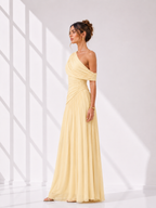 Woman wearing a yellow one-shoulder dress against a white background