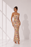 Woman wearing a floral dress on a white background