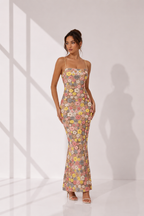 Woman wearing a floral dress on a white background