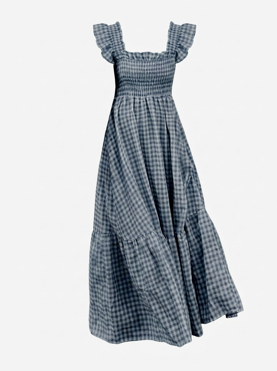 Blue checkered dress with ruffled straps on a white background
