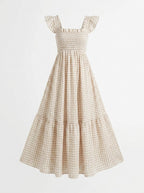 Beige checkered dress with ruffled sleeves on a white background