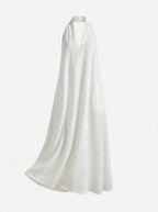 White halter neck dress on a white background