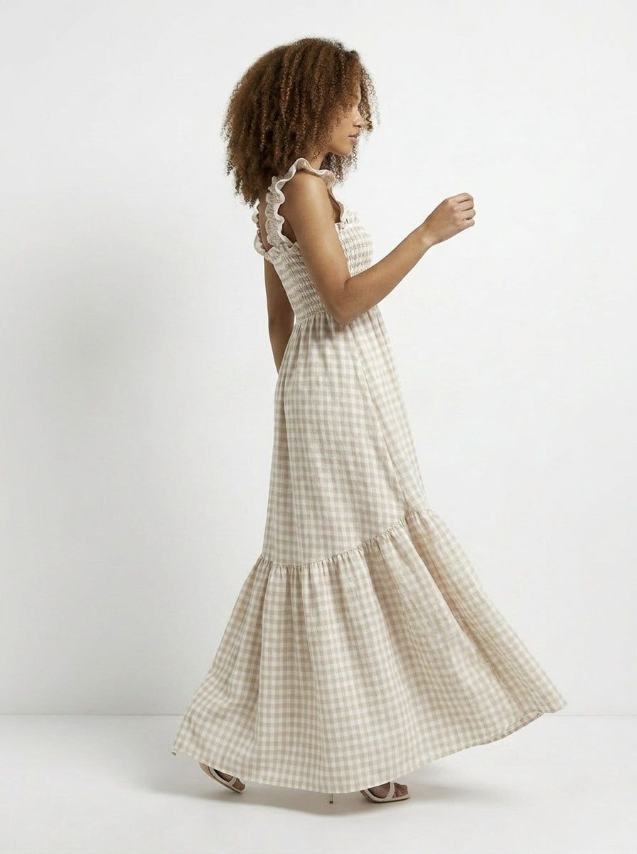 Woman wearing a checkered dress on a white background