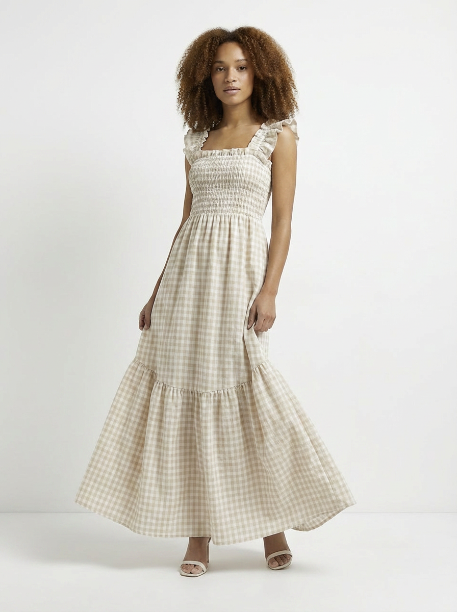 Woman wearing a checkered dress on a white background