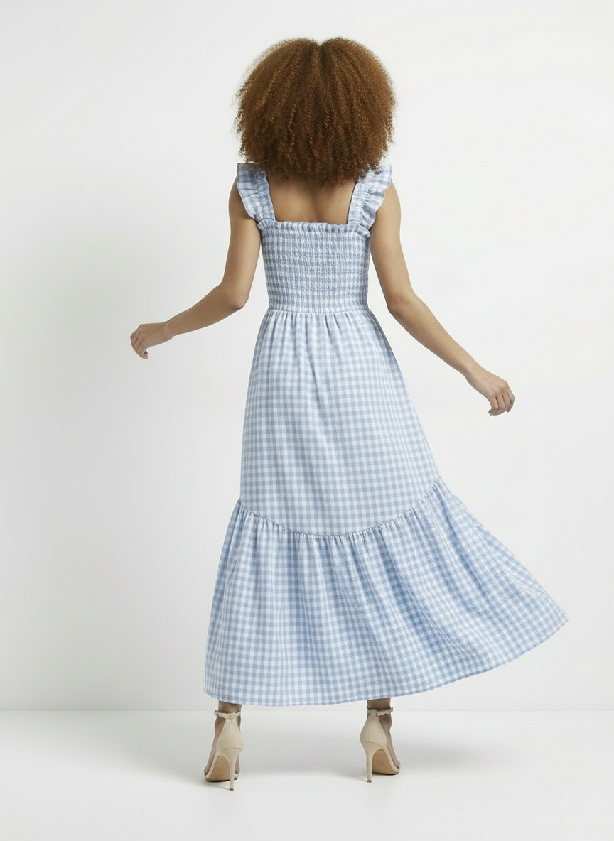 Woman wearing a blue checkered dress on a white background