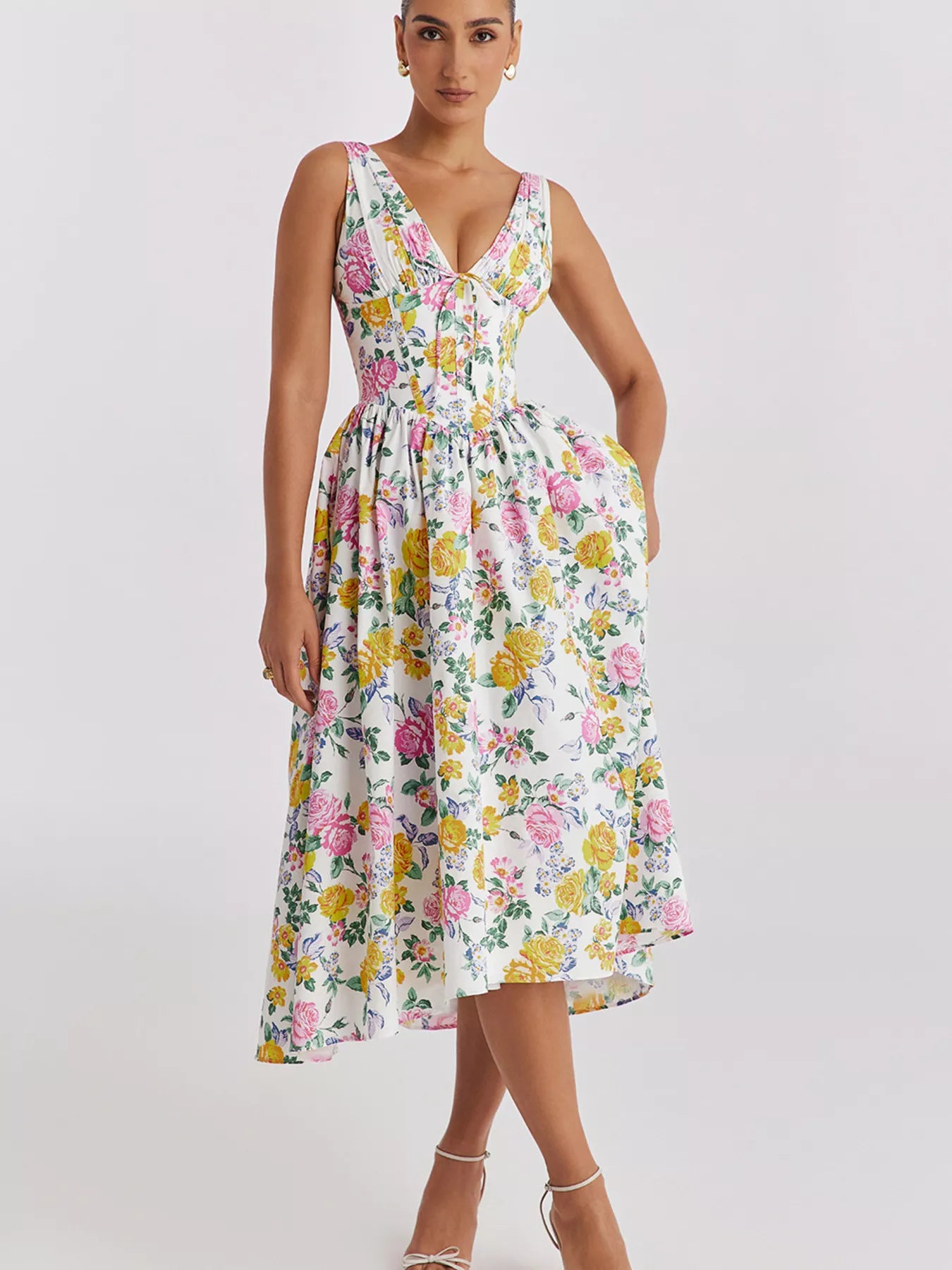 Woman wearing a floral dress on a white background
